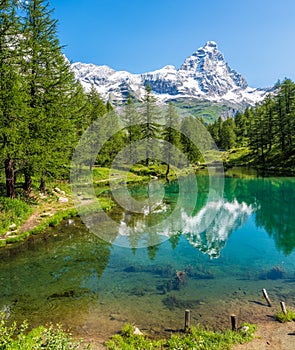 Blue Lake with the Matterhorn reflecting on the water, Valtournenche, Aosta Valley, Italy.