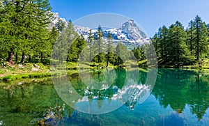 Blue Lake with the Matterhorn reflecting on the water, Valtournenche, Aosta Valley, Italy.