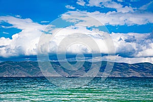 Blue lake, mountains and clouds