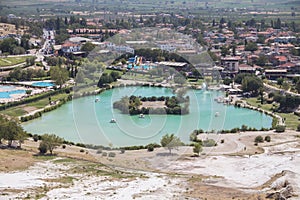 Blue lake near the travertines of Pamukkale in Turkey. Travel in Turkey.