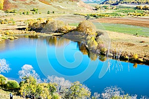 The blue lake water of Toad dam