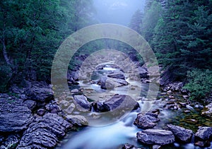 Blue landscape with river and cold winter light. Night and mystical atmosphere, magical and haunting. Ordesa Pyrenees