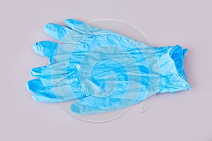 Blue latex medical gloves on white background