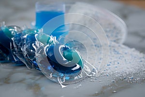 Blue laundry detergent sorts variety in powder, liquid gel and pod in washing dose