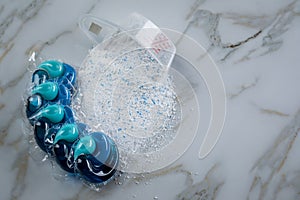 Blue laundry detergent sorts variety in powder and pod in washing dose