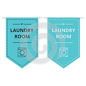 Blue laundry room banners in the shape of pennat with a washing machine icon on it