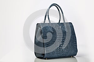 Blue Leather Crocodile Embossed women handbag on White background