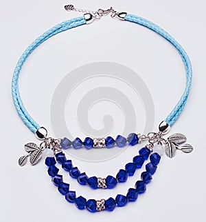 Blue leather necklace with silver leaves and blue gems