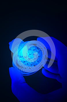 Blue led bulb in hand.