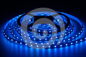 Blue LED strip on reel with black background