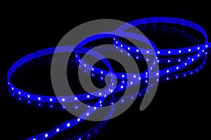 Blue LED strip tape on black background