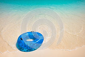 Blue Life Buoy on the White Beach