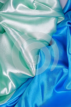 Blue and light green silk satin cloth of wavy folds texture back