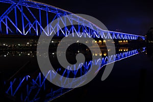 Blue light illuminated train bridge