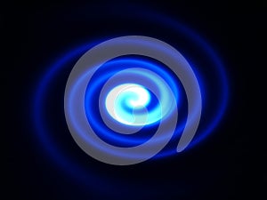 Blue light twirl spinning in the darkness