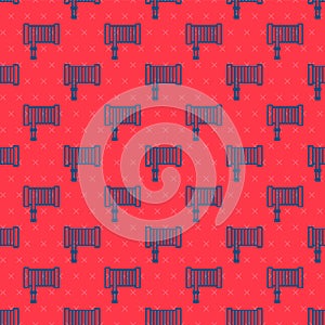 Blue line Fire hose reel icon isolated seamless pattern on red background. Vector