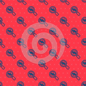 Blue line Magnifying glass with percent icon isolated seamless pattern on red background. Discount offers searching