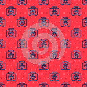 Blue line Pet first aid kit icon isolated seamless pattern on red background. Dog or cat paw print. Clinic box. Vector
