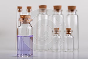 Blue liquid in a glass vial. Accessories in the laboratory