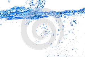 Blue lit water surface with wave and bubbles