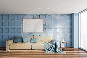 Blue living room with beige sofa and mockup poster