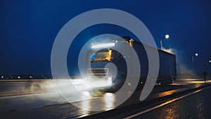 Blue Long Haul Semi-Truck with Cargo Trailer Full of Goods Travels At Night on the Freeway Road