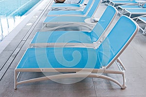 Blue loungers by the pool at the luxury spa.