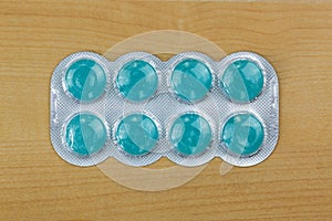 Blue lozenges medicine for severe sore throats with 2 antiseptic agents, anesthetic for effective pain relief photo