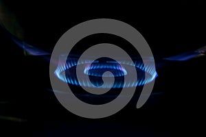 Blue LPG gas flame with black background