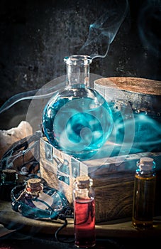 Blue magic potion with smoke Magical concept