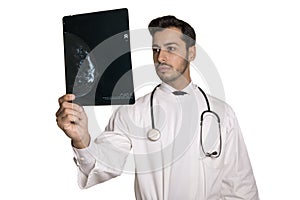 Blue mammogram being analysed by an beautiful doctor