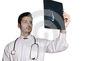 Blue mammogram being analysed by an handsome doctor