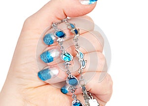 Blue manicure and bracelets