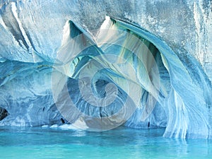 Blue marble caves from water