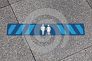 Blue marking indicating how much distance people should keep to be safe. 2.0 meters