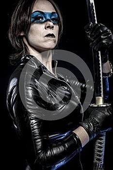 Blue mask, Woman with katana sword in latex costume