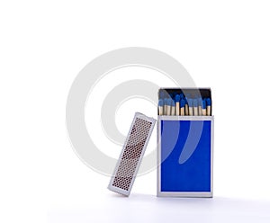 Blue matchbox with safety matches isolated on white background