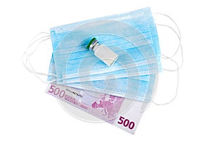 Blue medical face masks,  500 Euro banknote and vaccine isolated on white background