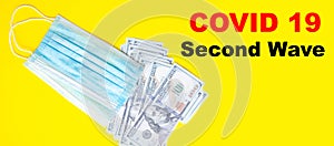 Blue medical mask with dollars on a blue, yellow, pink background. Mask and 100 dollar bills on a black background.  Copy Space.