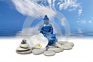 Blue Medicine Buddha Bhaisajyaguru,zen stone,white orchid flowers and sky reflected in water