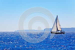 Blue Mediterranean sailboat sailing