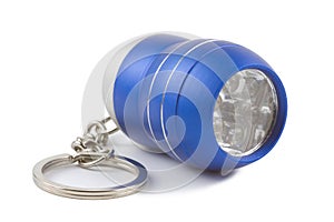 Blue metal LED flashlight keychain isolated