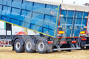 Blue metal semitrailer grain truck for transporting bulk materials