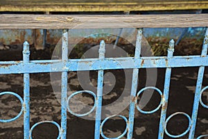 Blue metal texture from old iron bars in a forged pattern in the wall