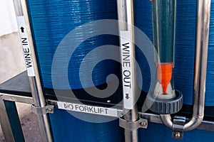 Blue metal wine fermentation tanks from a winery