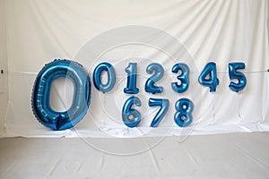 Blue metallic balloons in numbers photo