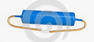 Blue metallized power electronic resistor with gilded terminal wires on white background photo