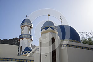 Blue minaret at habour in Oman photo