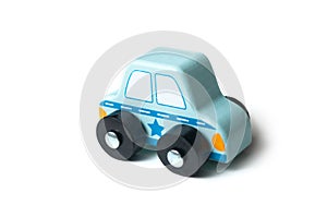 blue miniature wooden car on white background - concept police patrol