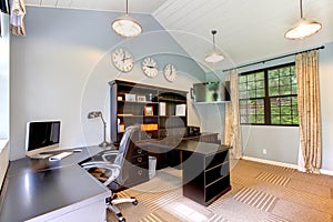 Blue modern home office with dark brown furniture.